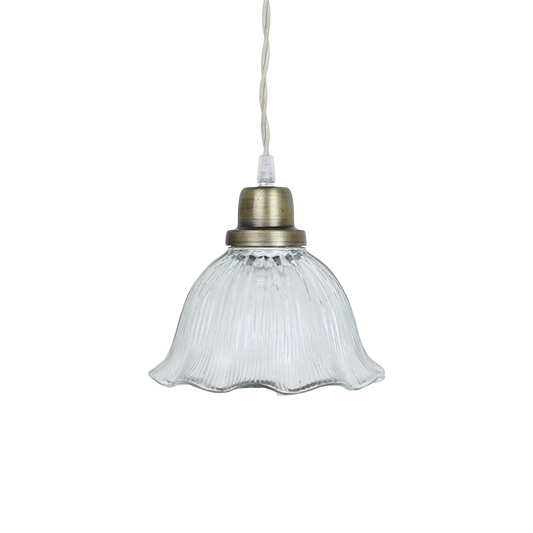 Rocio pendant lamp with wavy clear glass shade and antique brass fixture