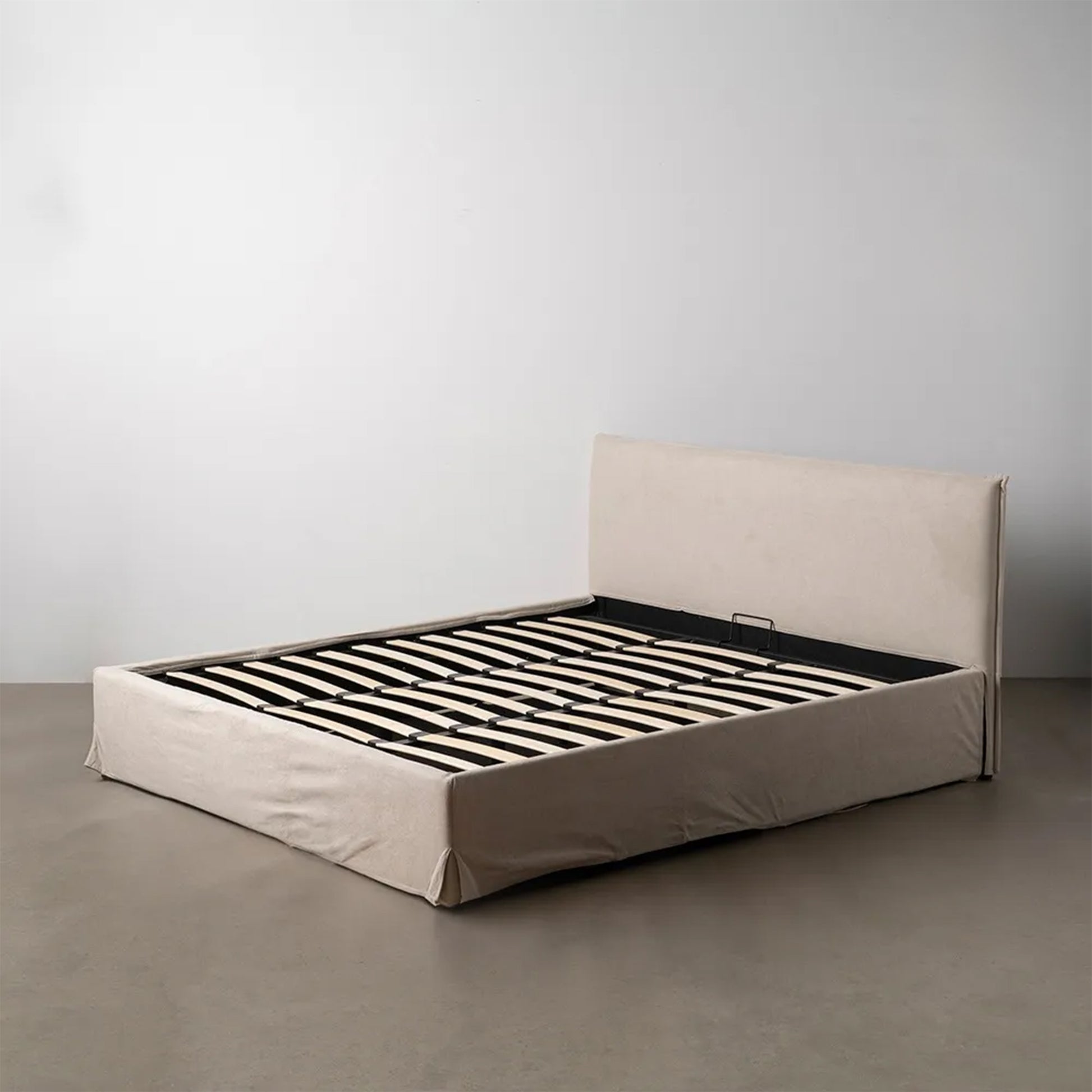 Raúl beige fabric storage bed with lift-up slatted base and minimalist upholstered headboard