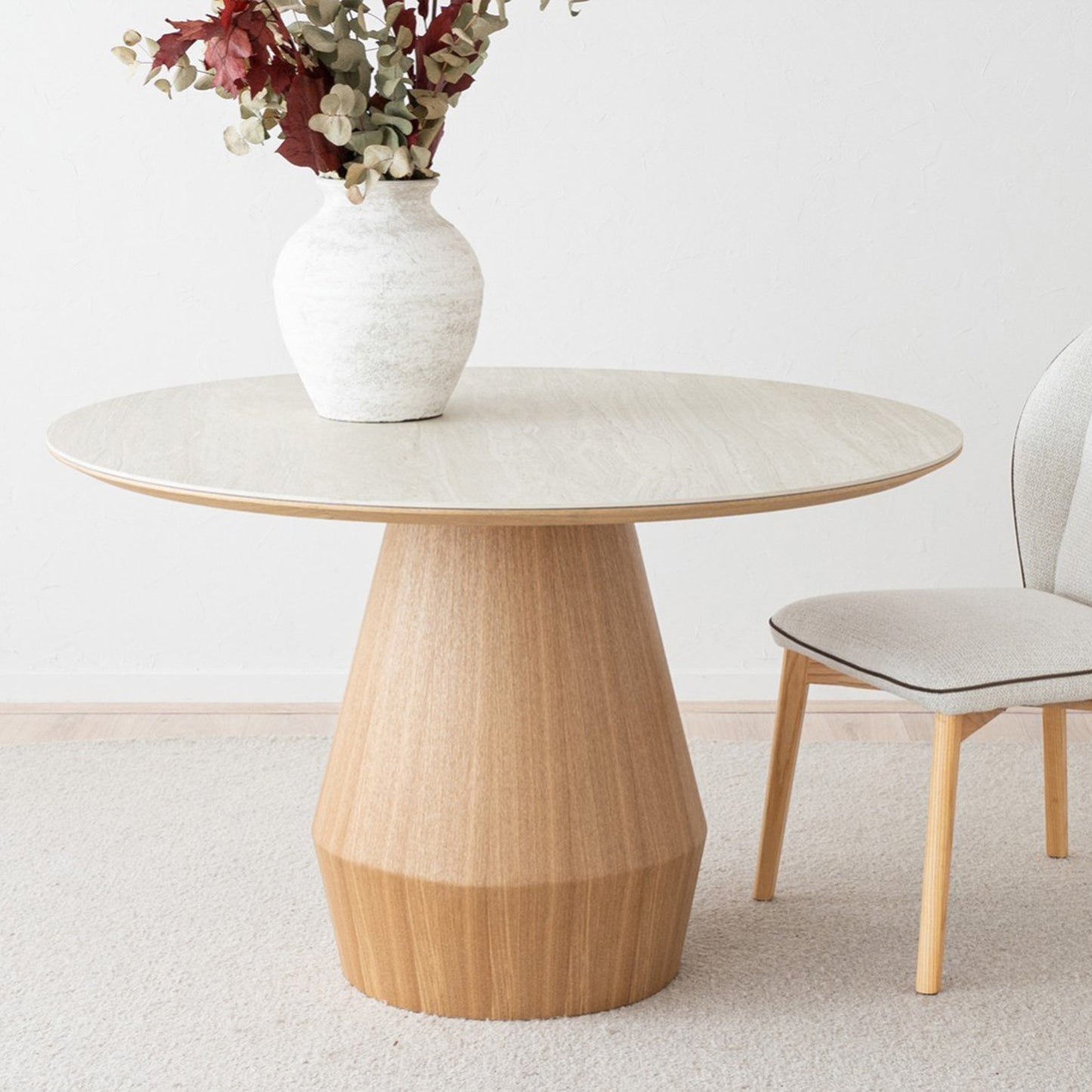 Mateo round dining table with ceramic marble top and natural ash wood conical base