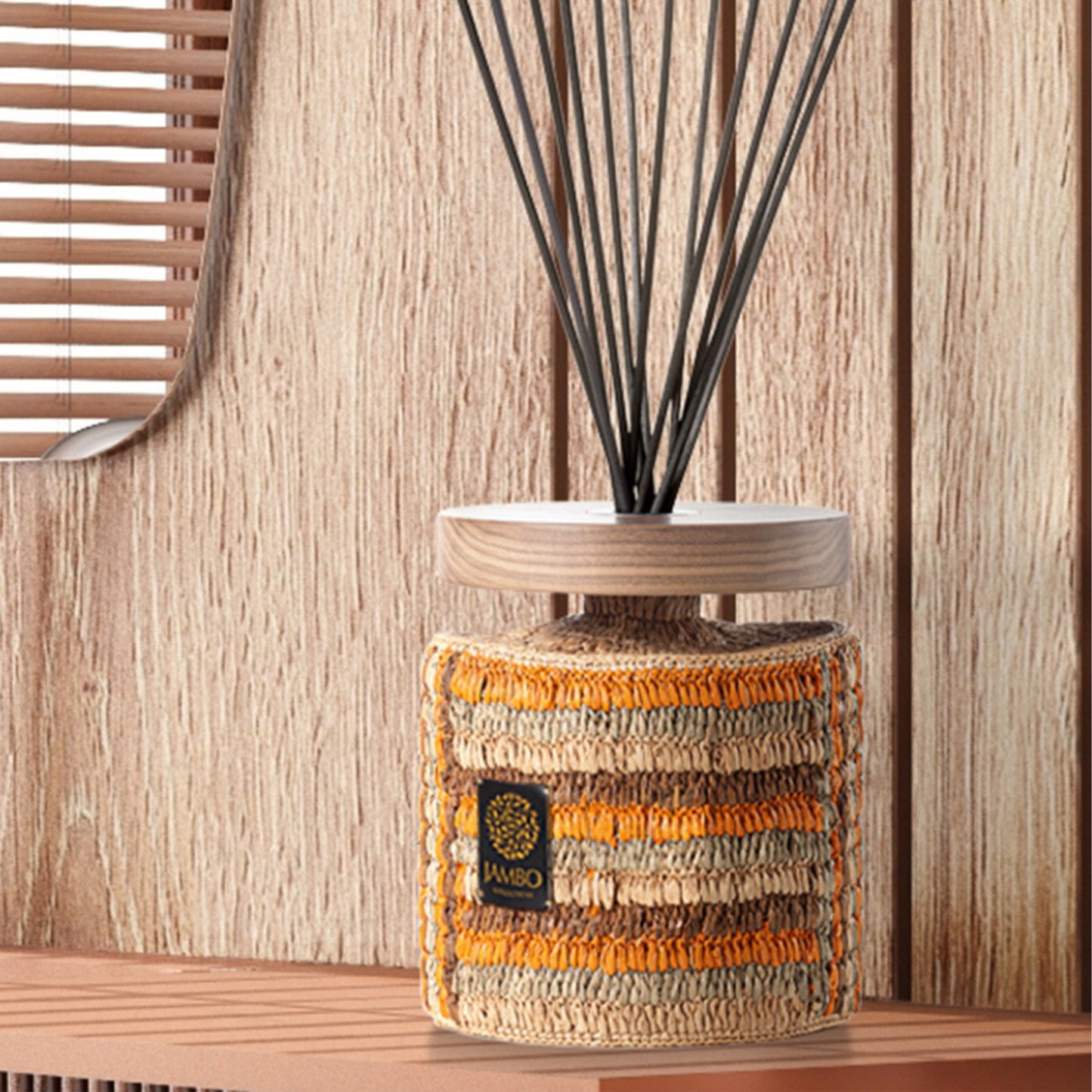 MASOALA Raffia Diffuser from Jambo Exclusivo – natural woven diffuser with vanilla, plum, and cedarwood notes.