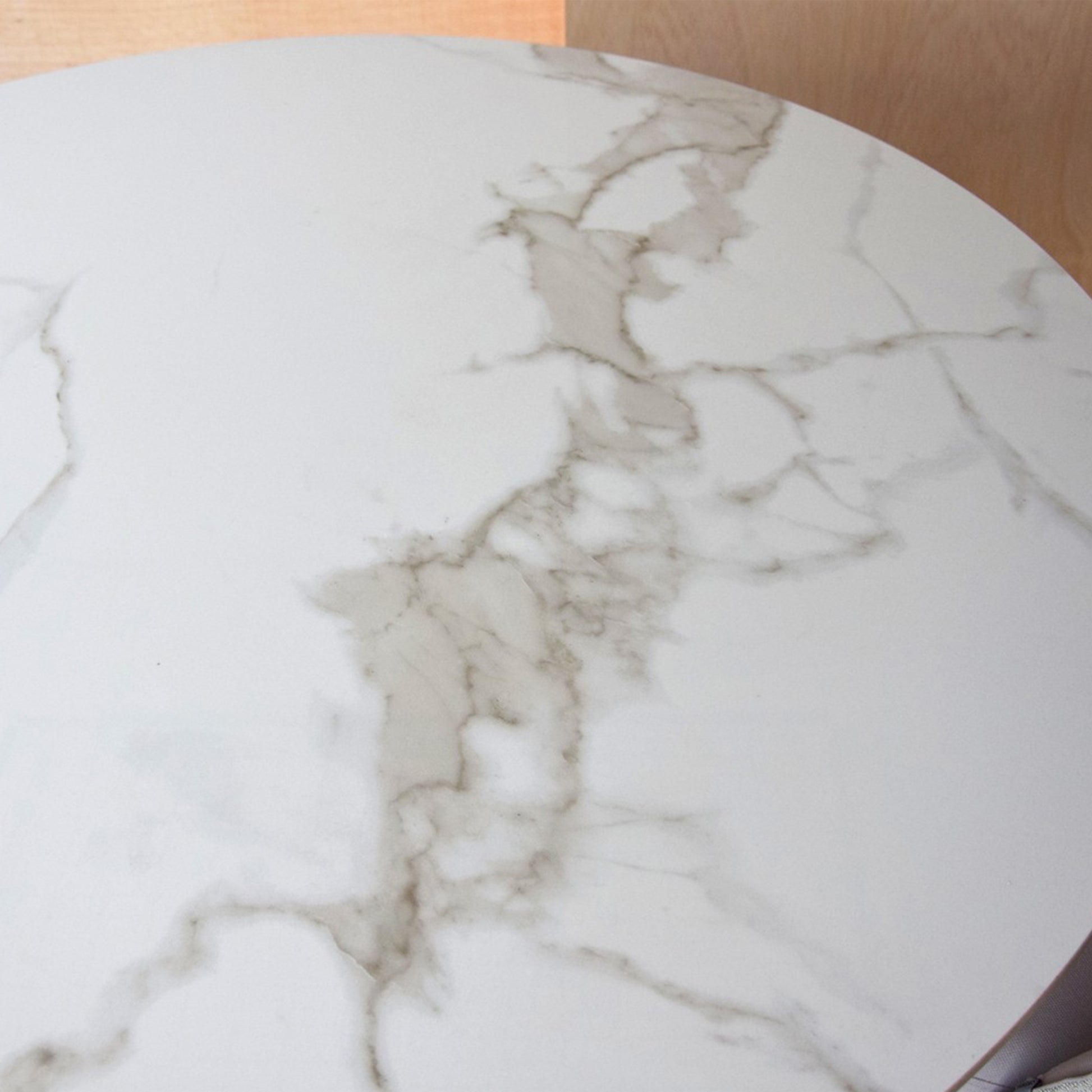 Matias round dining table with white ceramic marble top and matte black conical base