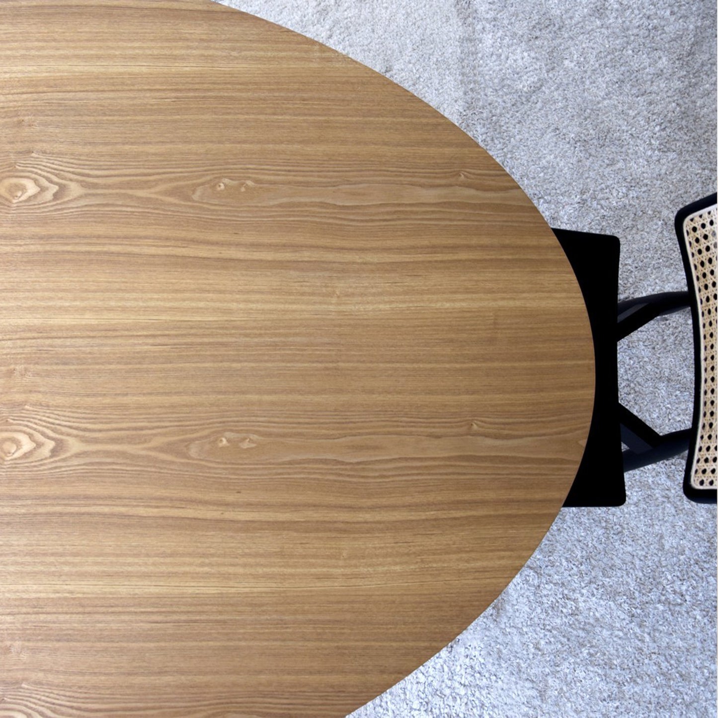 Maximo natural ash oval dining table with curved base and soft wood veneer finish