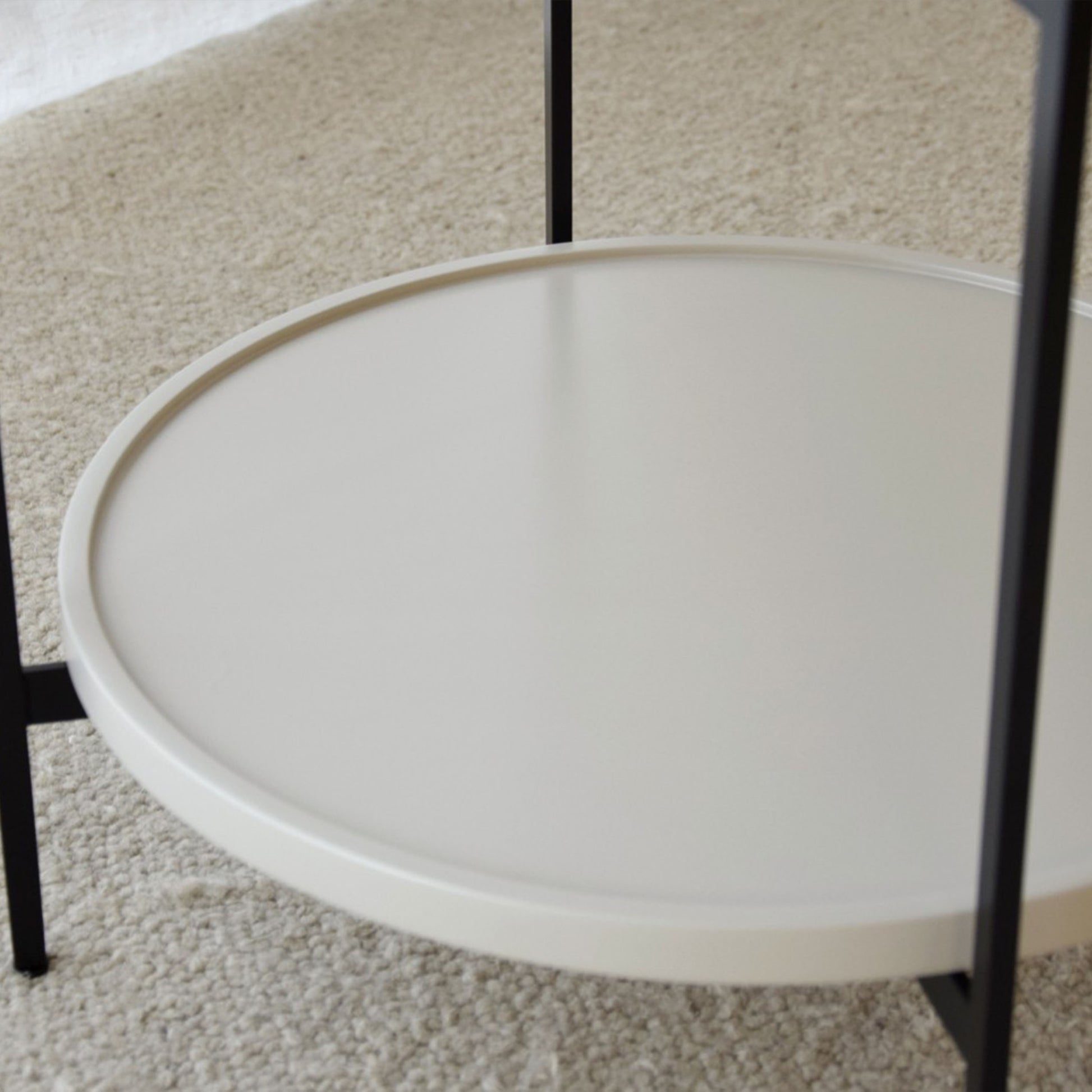 Juan White Ceramic Marble Side Table with round silhouette, drawer, and black metal legs