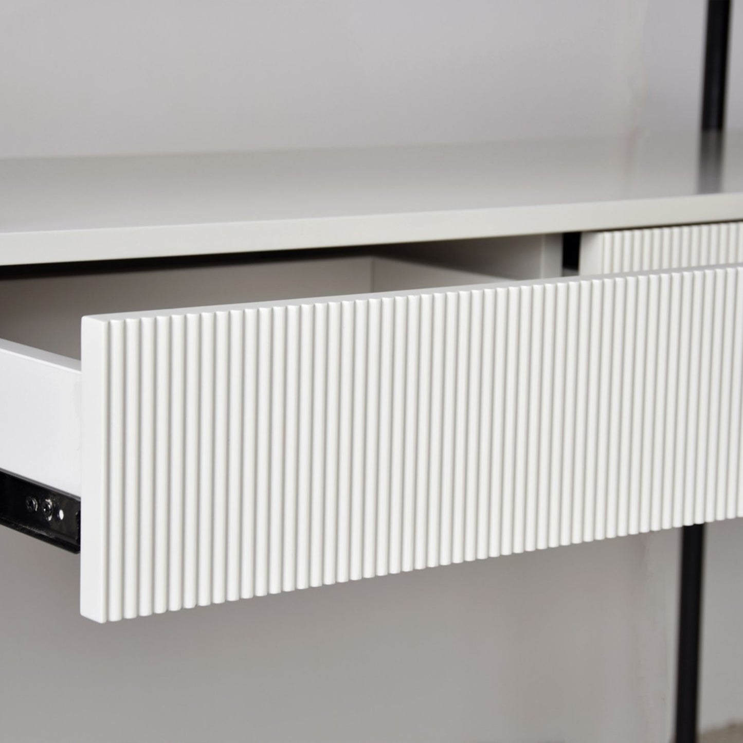 Javier White Ceramic Console Table with black metal frame and grooved drawer front