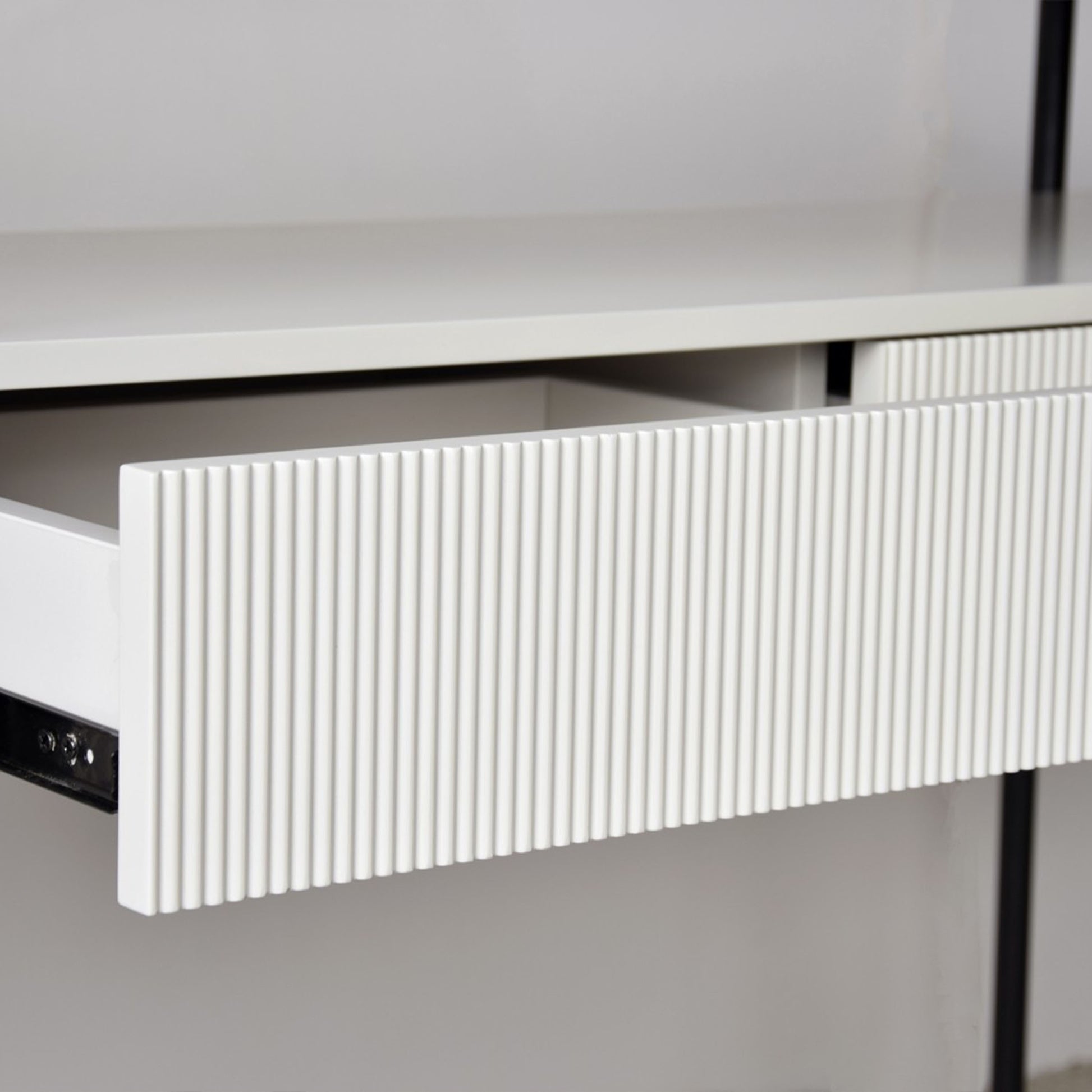 Javier White Ceramic Console Table with black metal frame and grooved drawer front