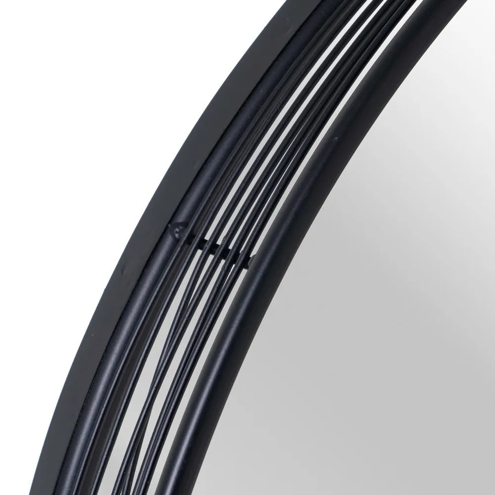Paula black metal circular mirror in a modern decor setting