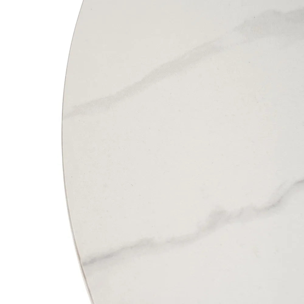 Orla white ceramic and natural metal coffee table in a contemporary setting