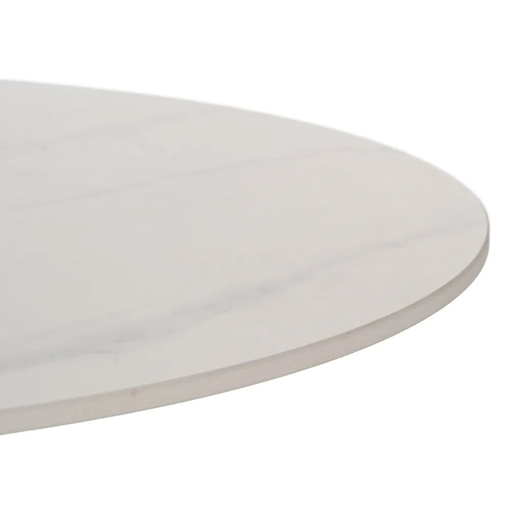 Orla white ceramic and natural metal coffee table in a contemporary setting