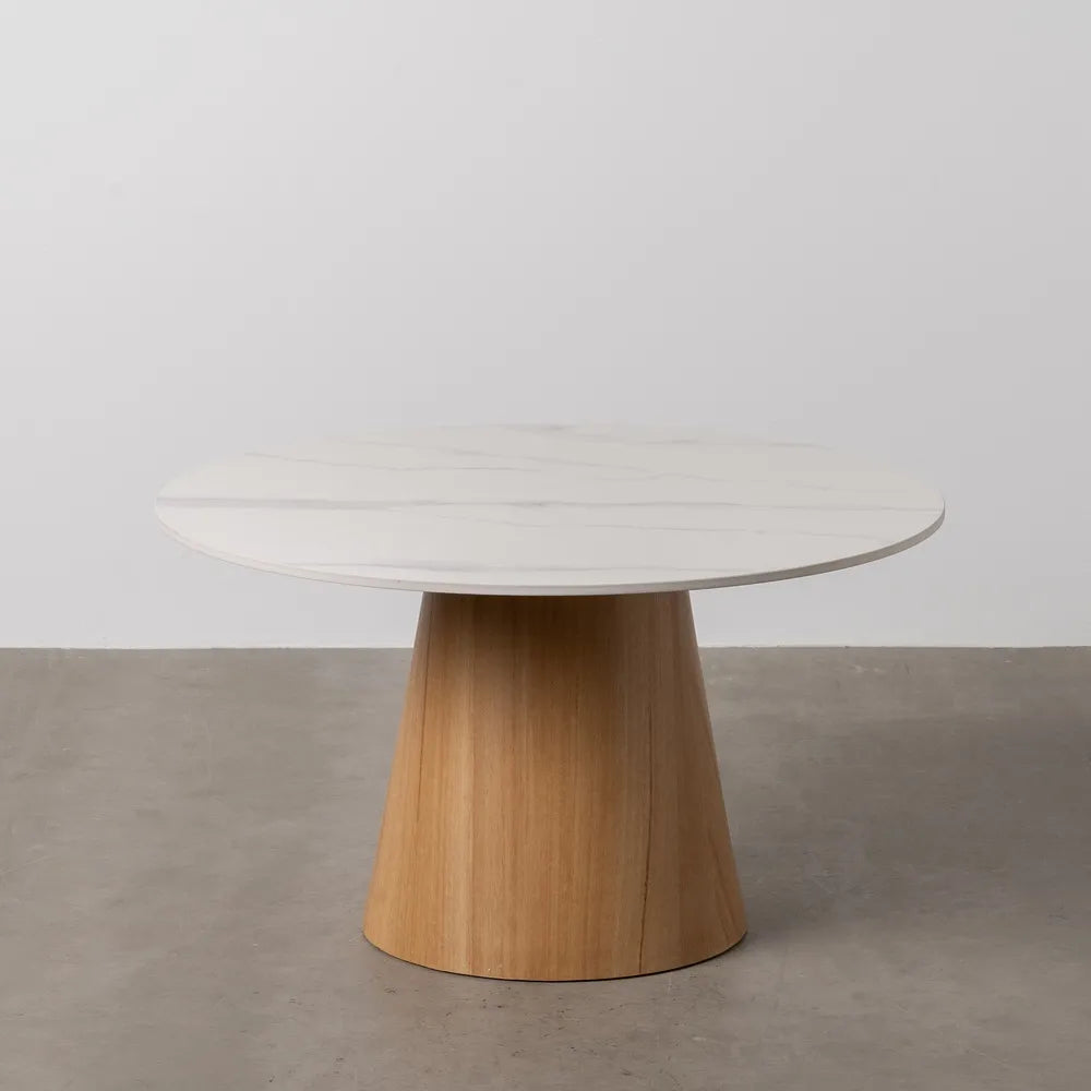 Orla white ceramic and natural metal coffee table in a contemporary setting