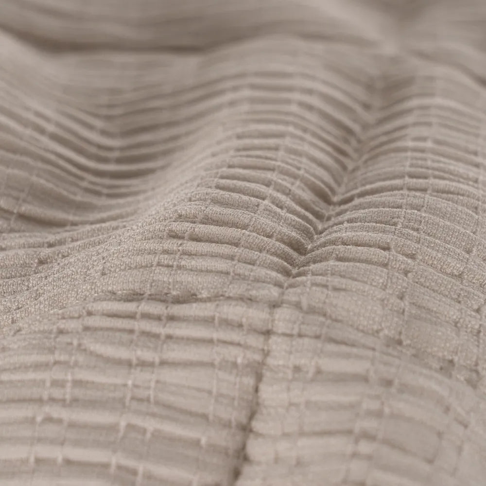 Martina beige and grey polyester quilts neatly folded in a bedroom setting