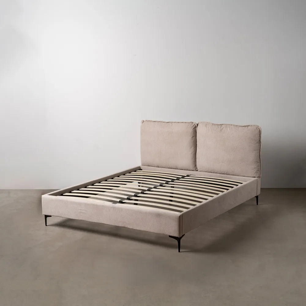 Nil upholstered bed in beige fabric with soft headboard and black metal legs