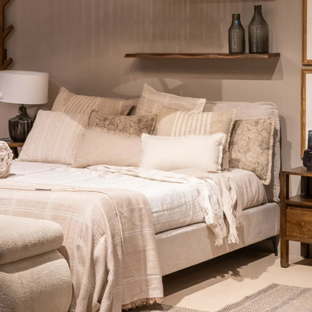 Pablo king size upholstered bed with beige fabric, cushioned headboard and black metal legs