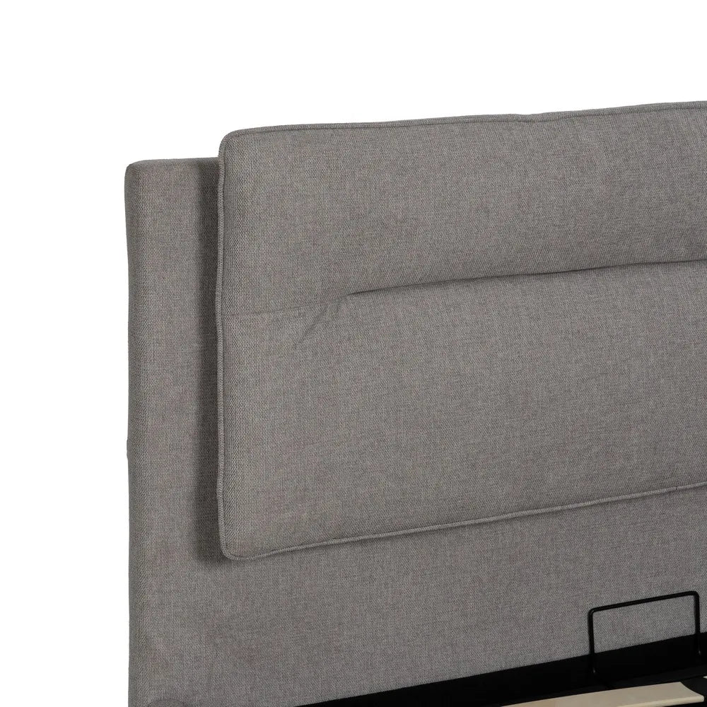 Pedro grey upholstered storage bed with lift-up base and cushioned headboard