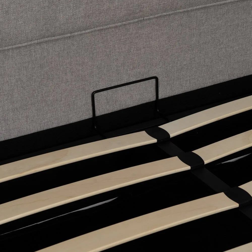 Pedro grey upholstered storage bed with lift-up base and cushioned headboard