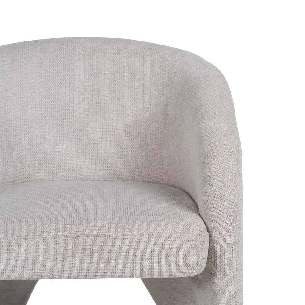 SORC modern curved armchair with fully upholstered frame and integrated legs
