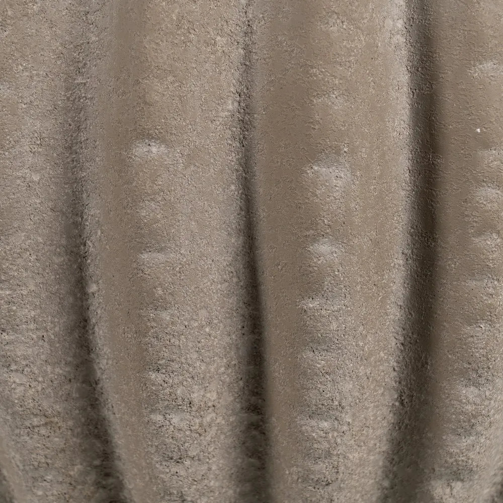 Aine dark grey ceramic vase with textured surface in a sophisticated setting