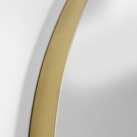 Round SELENA mirror with bark-textured antique gold frame.