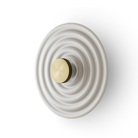 IDRIS Wall Light in white resin with matt brass center, offering sophisticated, modern lighting