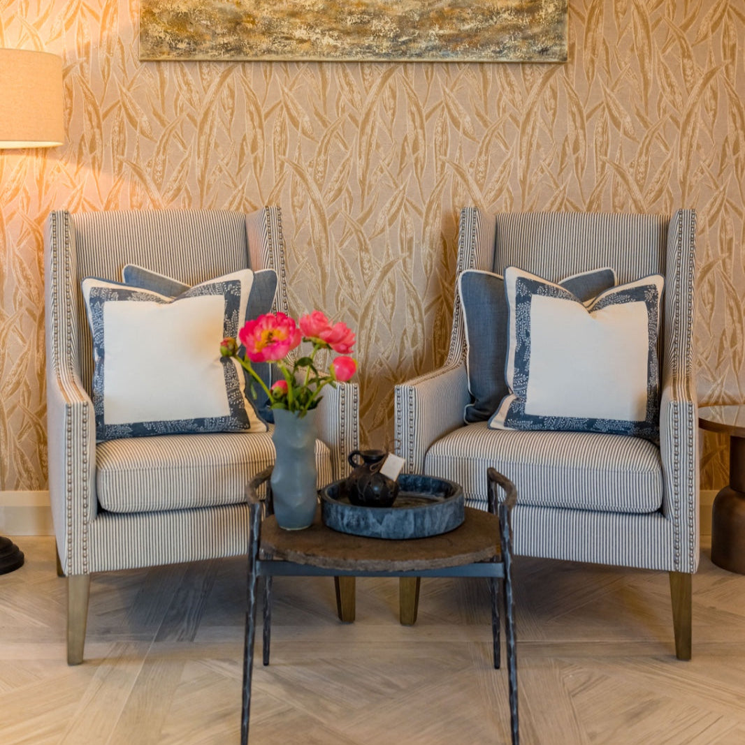 PRIYANKA Striped fabric chair with silver stud accents.