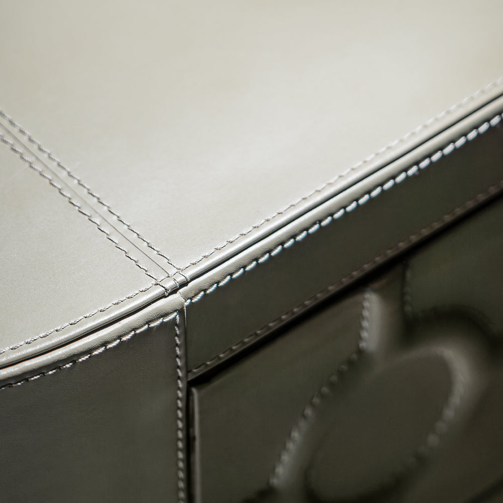 Luxury BOBBY leather 4-drawer chest in mushroom tone with brass ring handles.