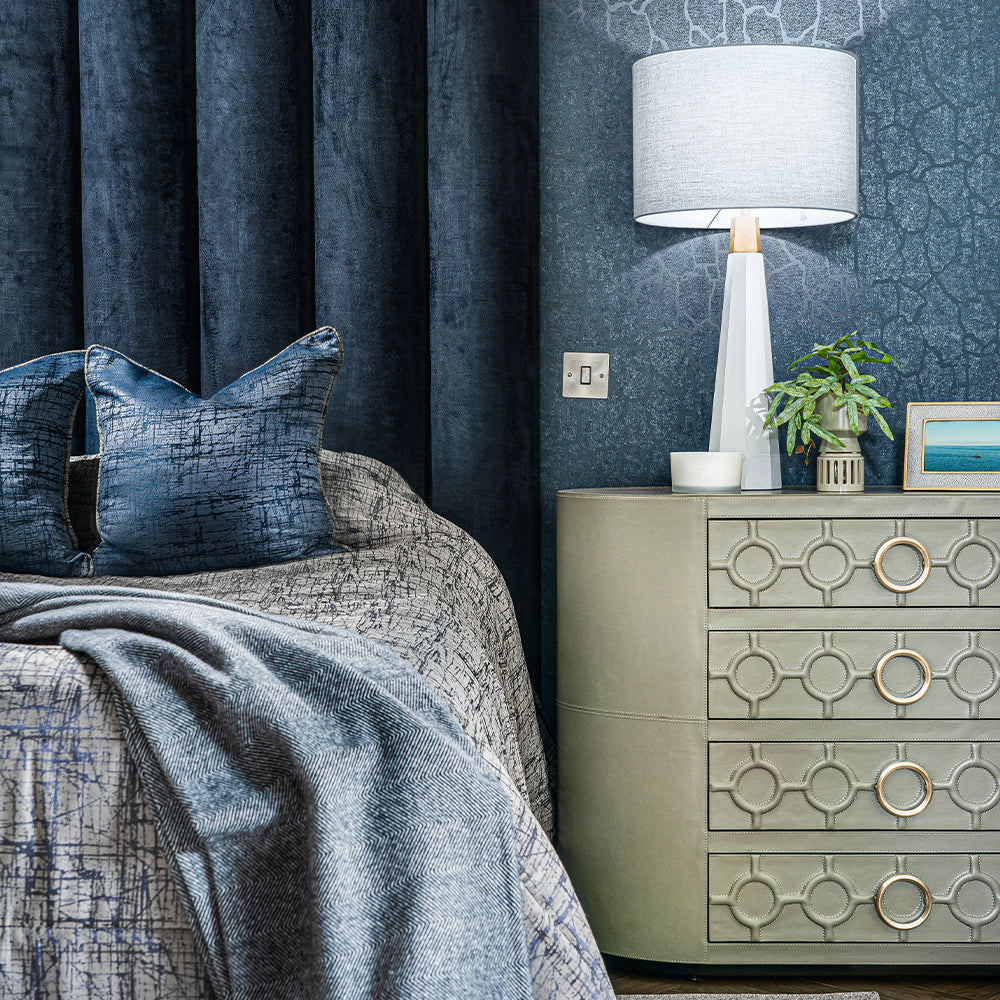 Luxury BOBBY leather 4-drawer chest in mushroom tone with brass ring handles.