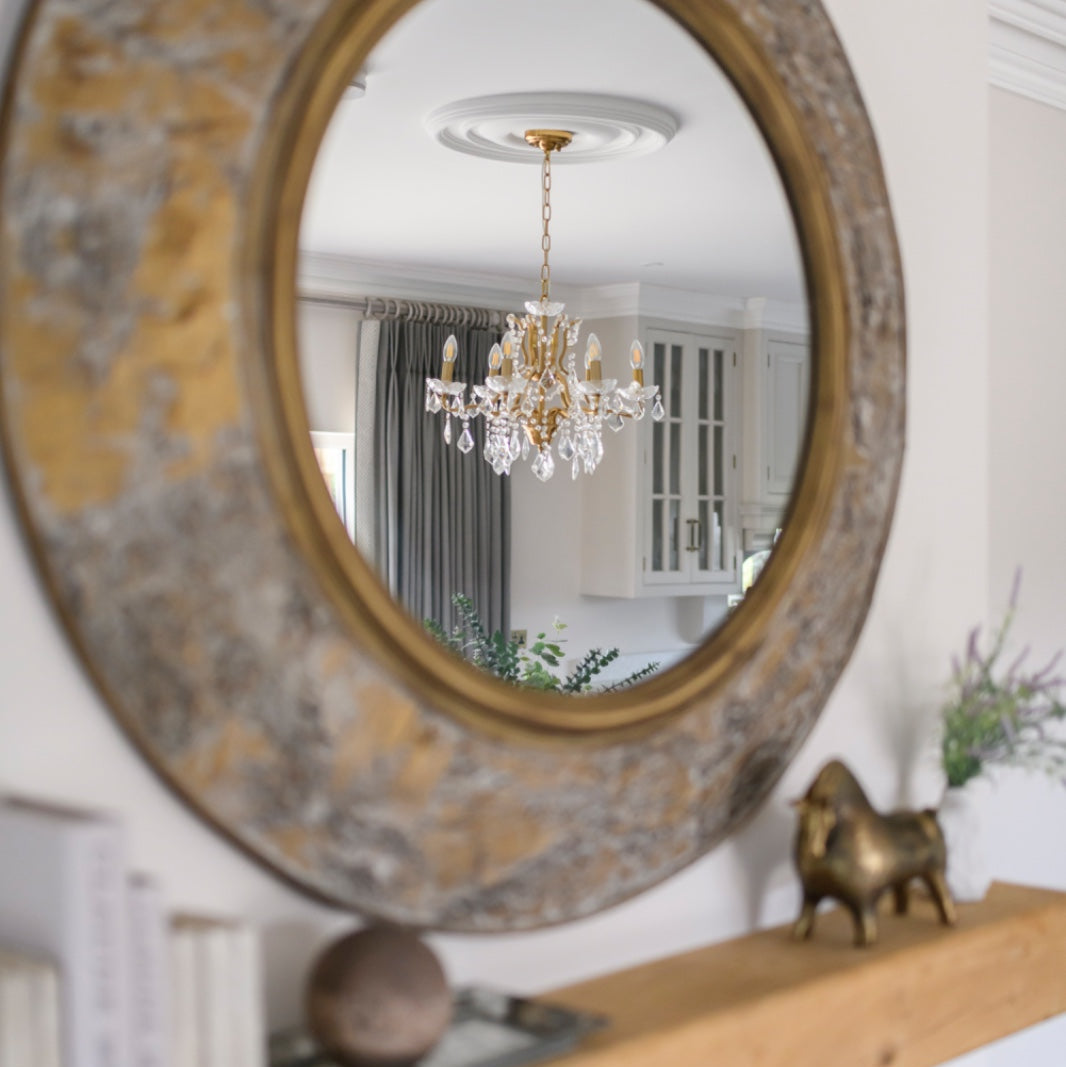 BRAD Round mirror with bark-textured antique gold frame.