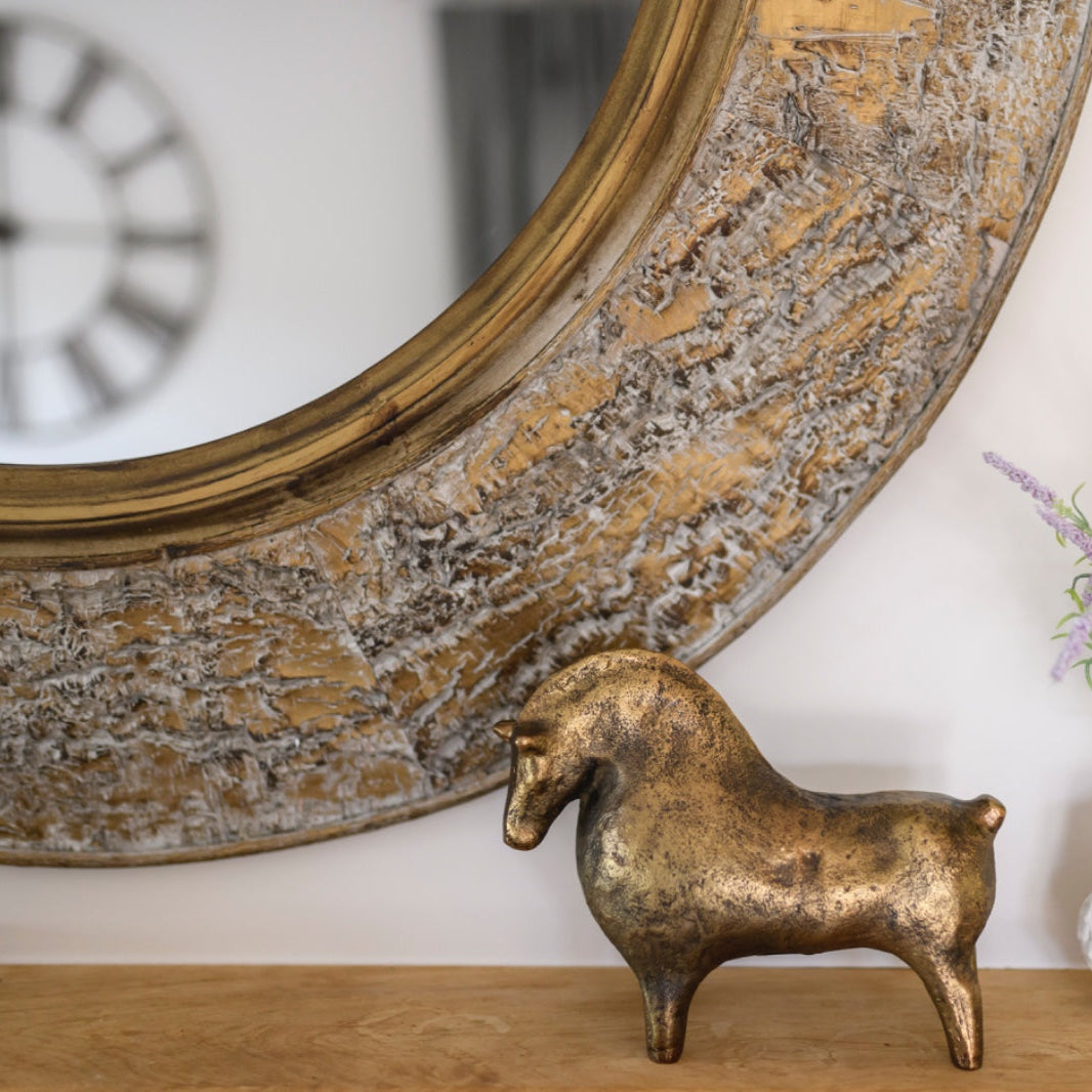 BRAD Round mirror with bark-textured antique gold frame.
