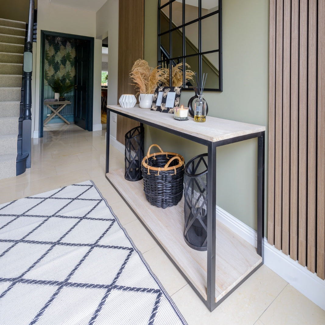 JENNIFER Rustic console unit with black iron frame and weathered wooden shelves for minimalist industrial interiors.