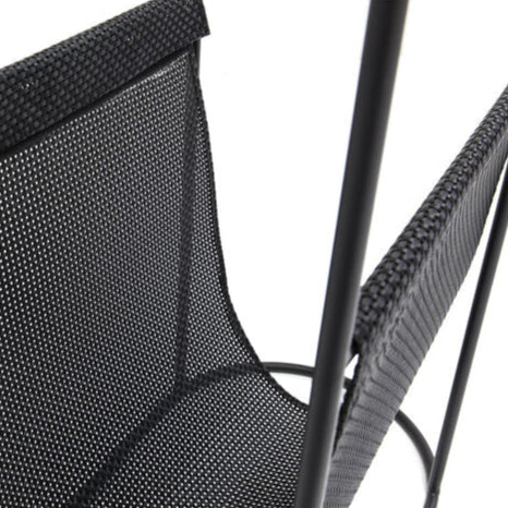 REY Journal Side Table with tempered glass top and black metal mesh pocket for storage.