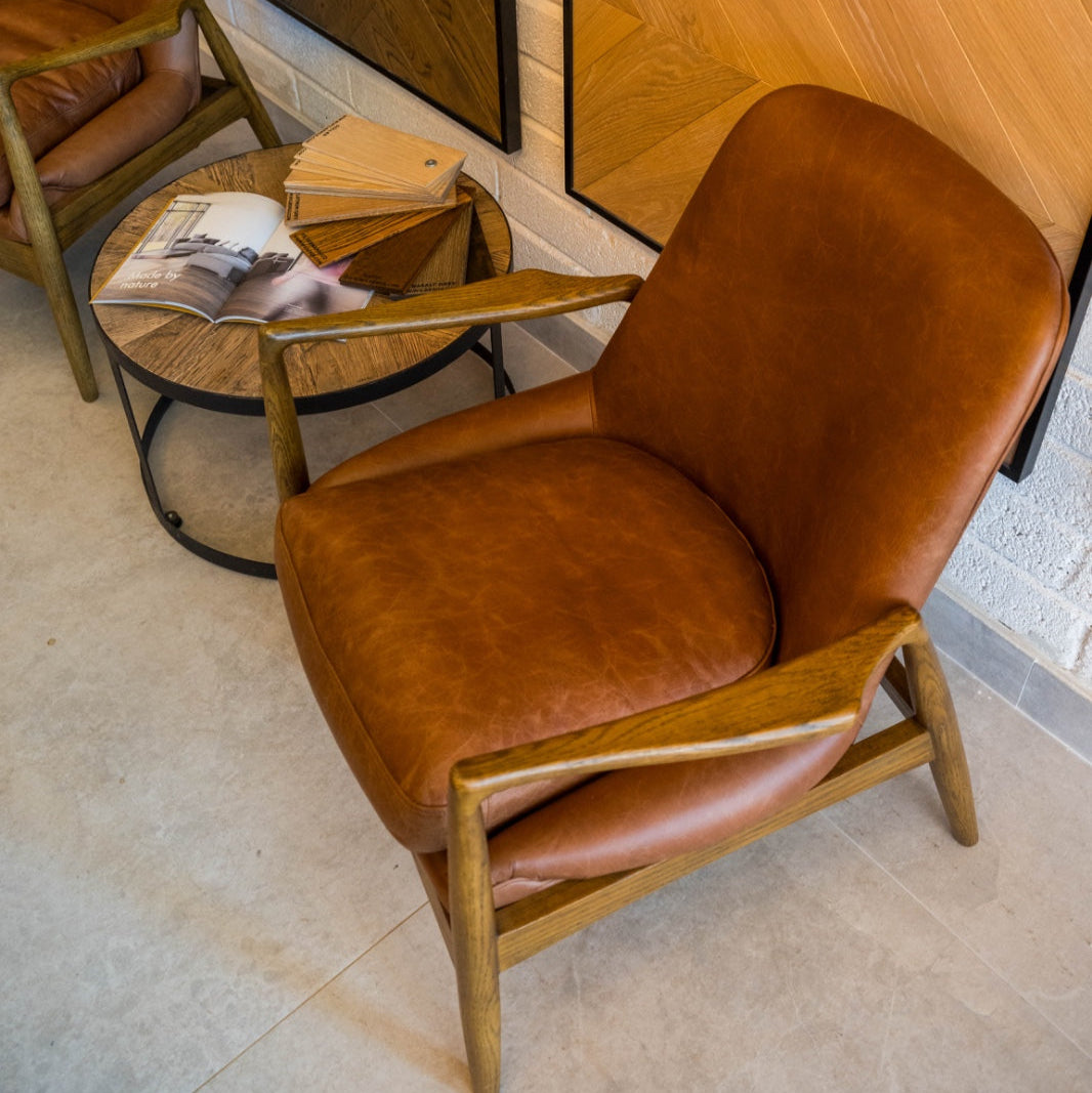 SANDRA leather armchair with solid oak frame, mid-century modern design, and premium padded cushions for luxurious comfort.