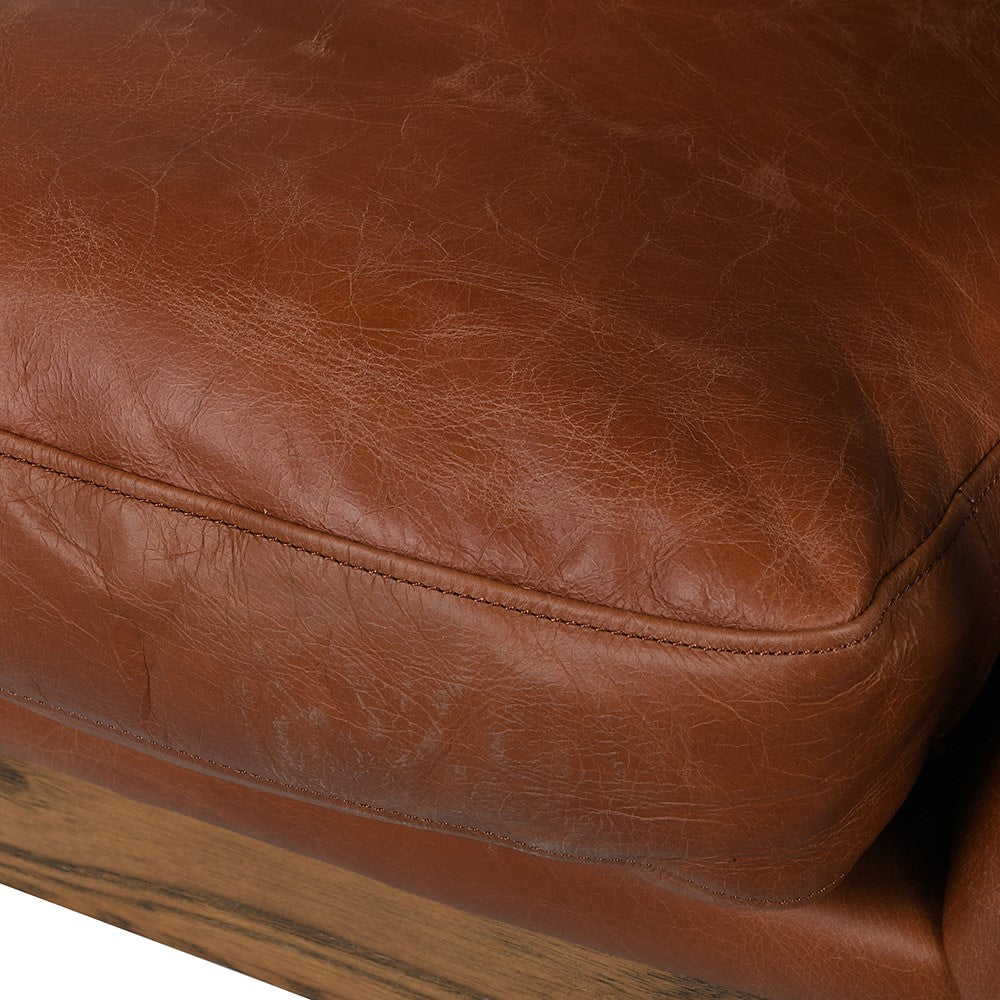 SANDRA leather armchair with solid oak frame, mid-century modern design, and premium padded cushions for luxurious comfort.