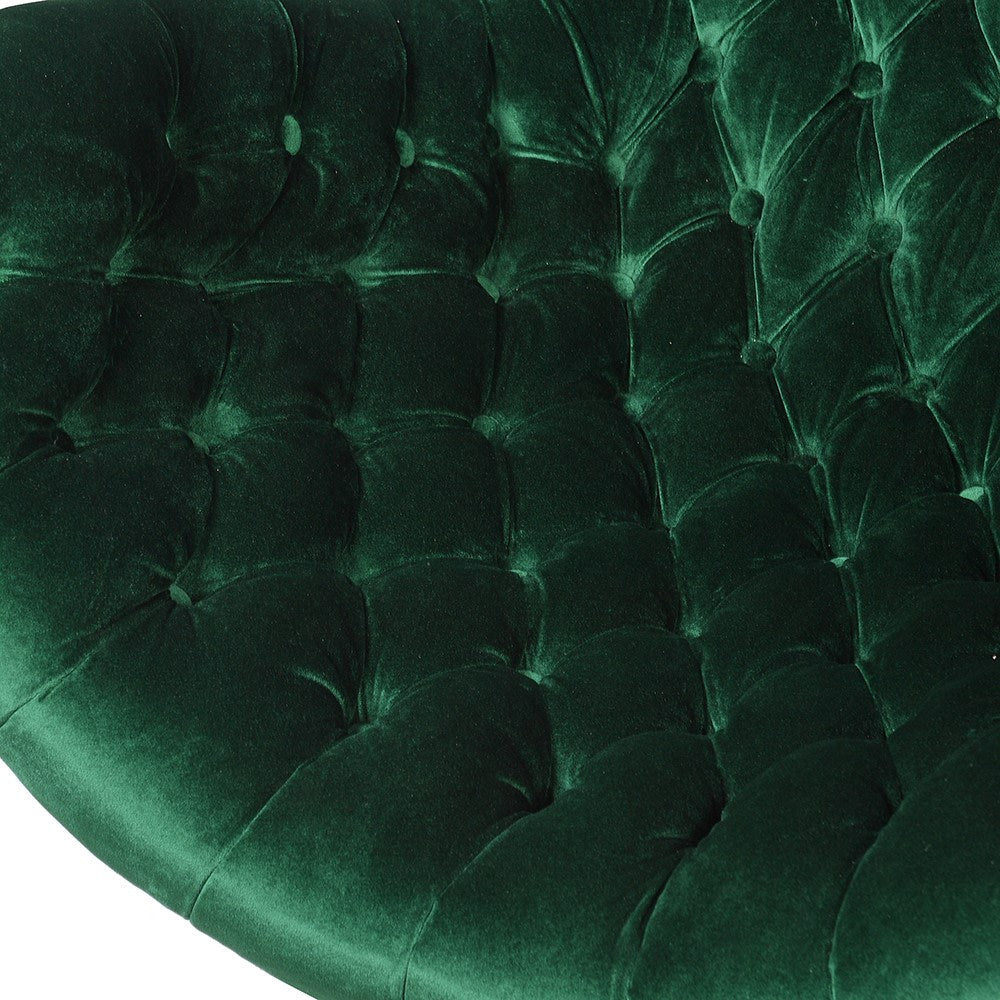 DEMI green curved chair with button-tufting, velvet upholstery, and black base for luxurious comfort and elegant design.