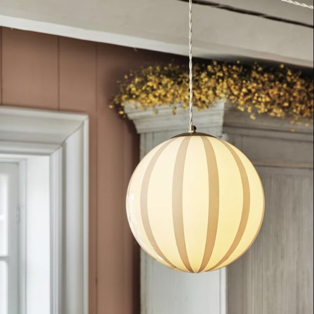 Elegant globe-shaped ceiling light with warm beige striped opal glass.