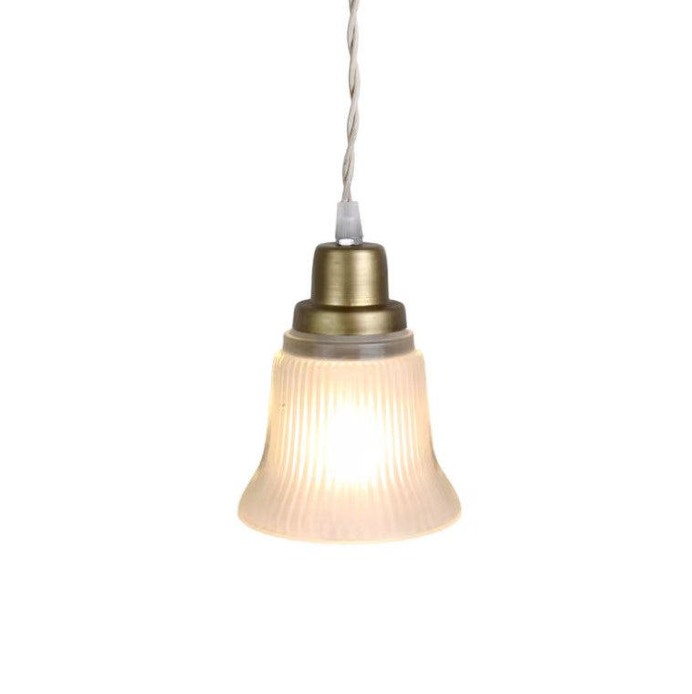SANDRA pendant light with fluted glass bell-shaped shade, warm iron fittings, and twisted fabric flex.
