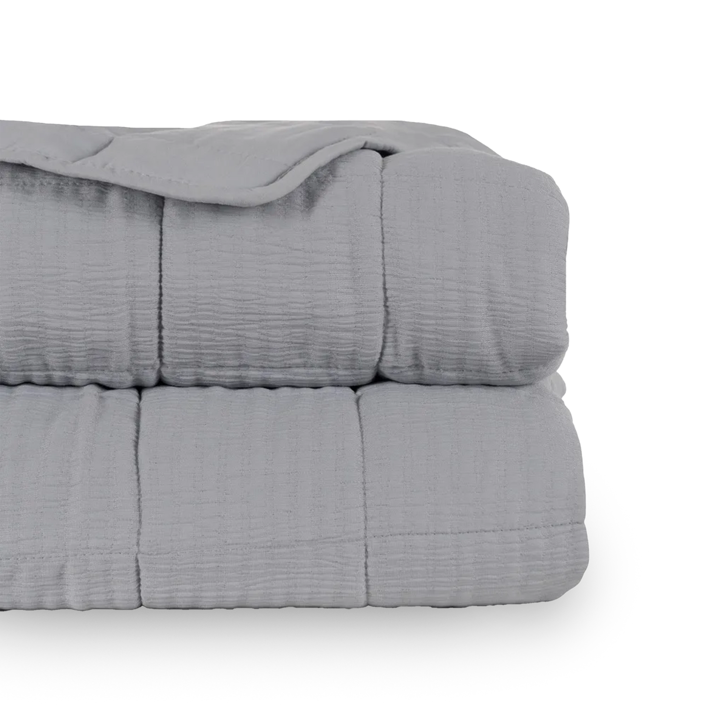 Martina beige and grey polyester quilts neatly folded in a bedroom setting