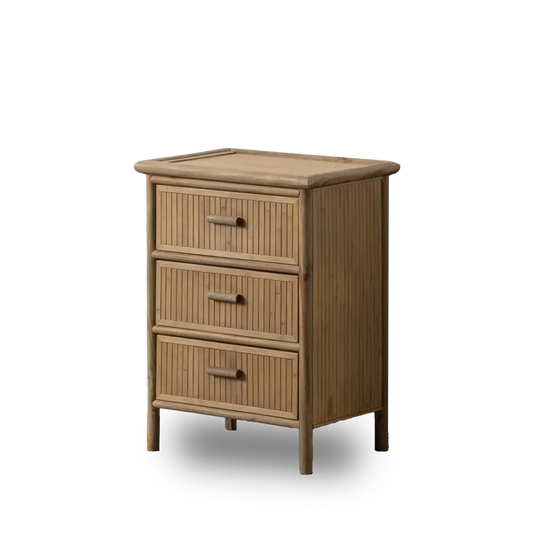 Mateo natural bamboo side table with three drawers in minimalist room