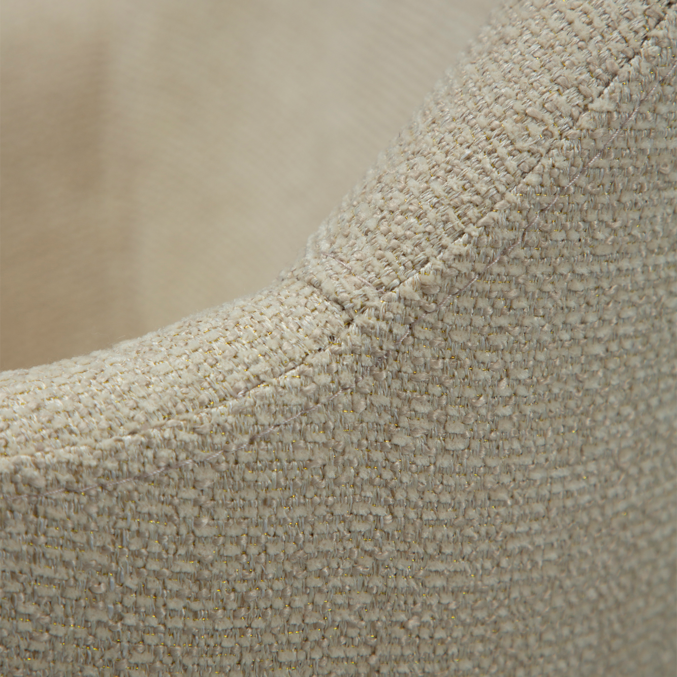 OLA dining chair in frosted almond boucle with curved arms and antique brass legs by AK Interior Living