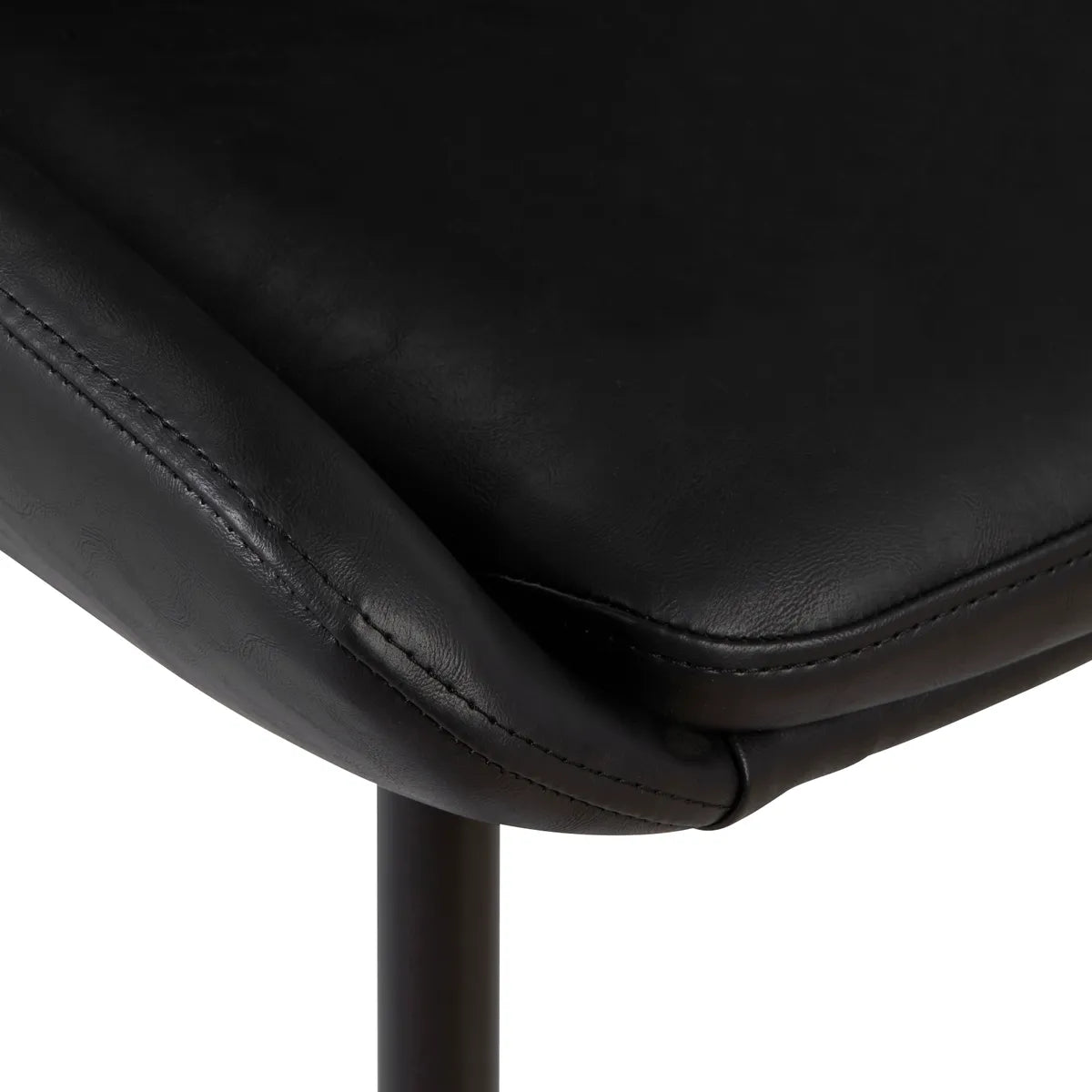 Side view of LUCE dining chair in PU with black metal legs and curved seat
