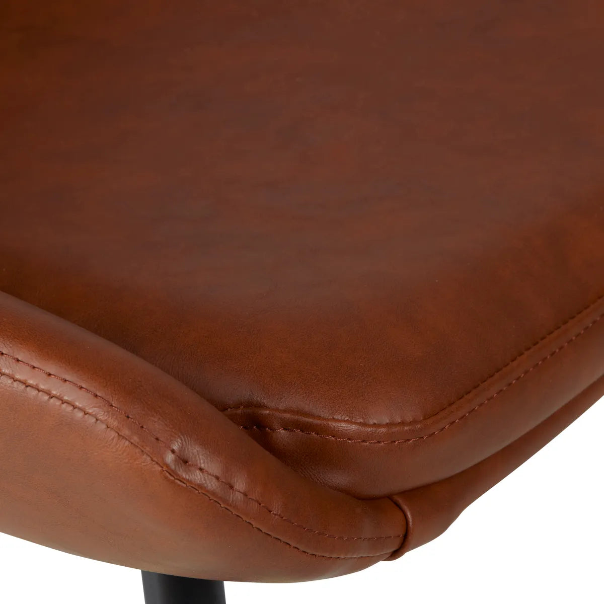 Side view of LUCE dining chair in PU with black metal legs and curved seat