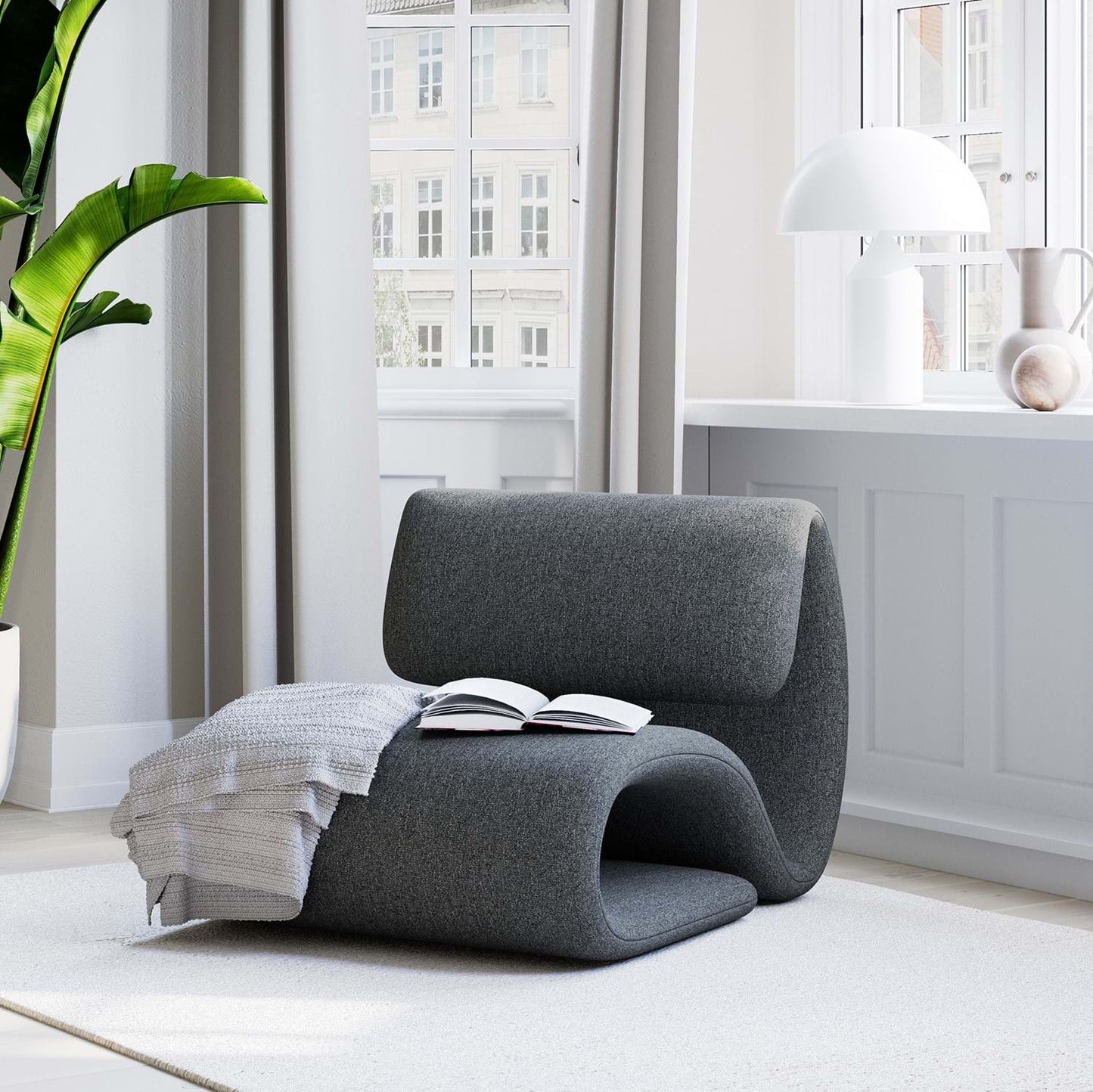 BEBE sculptural upholstered lounge chair with curved silhouette from AK Interior Living