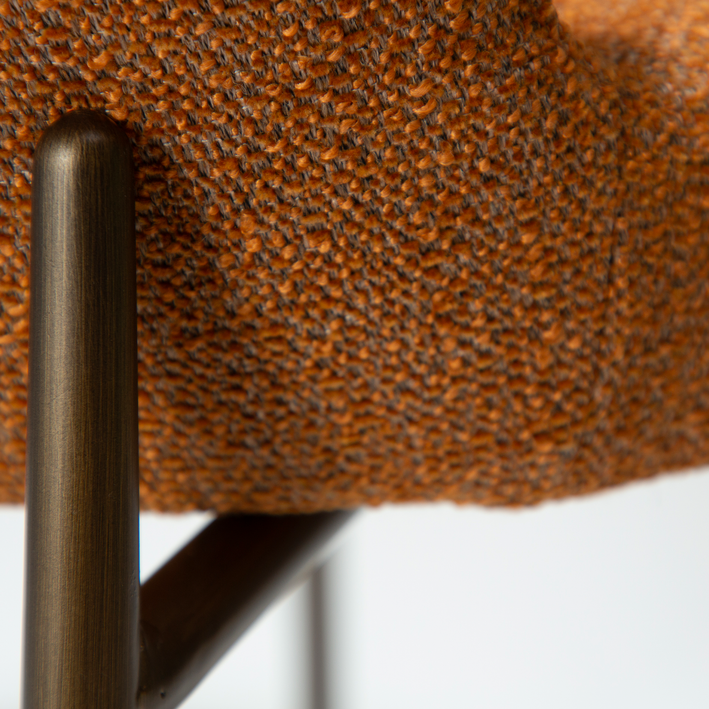LELA bouclé dining chair with curved back and antique brass legs from AK Interior Living
