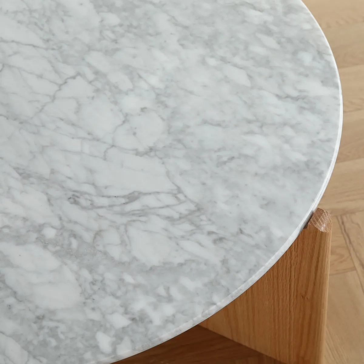Riley coffee table with white marble top and oak veneer legs in a modern living room setting