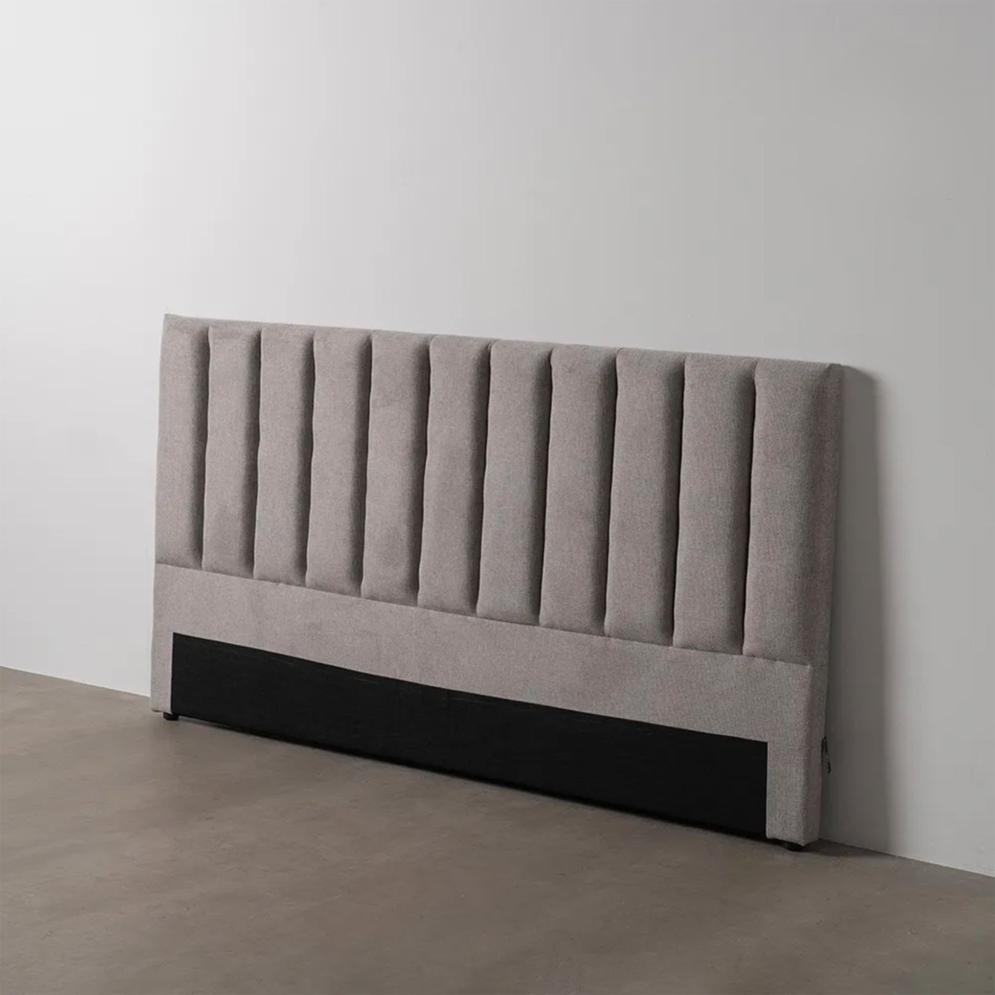 Amaia grey upholstered headboard with vertical channels, 190 cm wide, ideal for king or queen size beds, modern fabric design