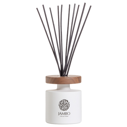 Papua Reed Diffuser – matte-white luxury diffuser with apple, mint, cocoa, and moss notes from Jambo Prestigio Collection.