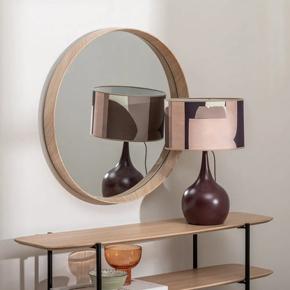 Alba round wall mirror with natural nude MDF frame in a modern interior
