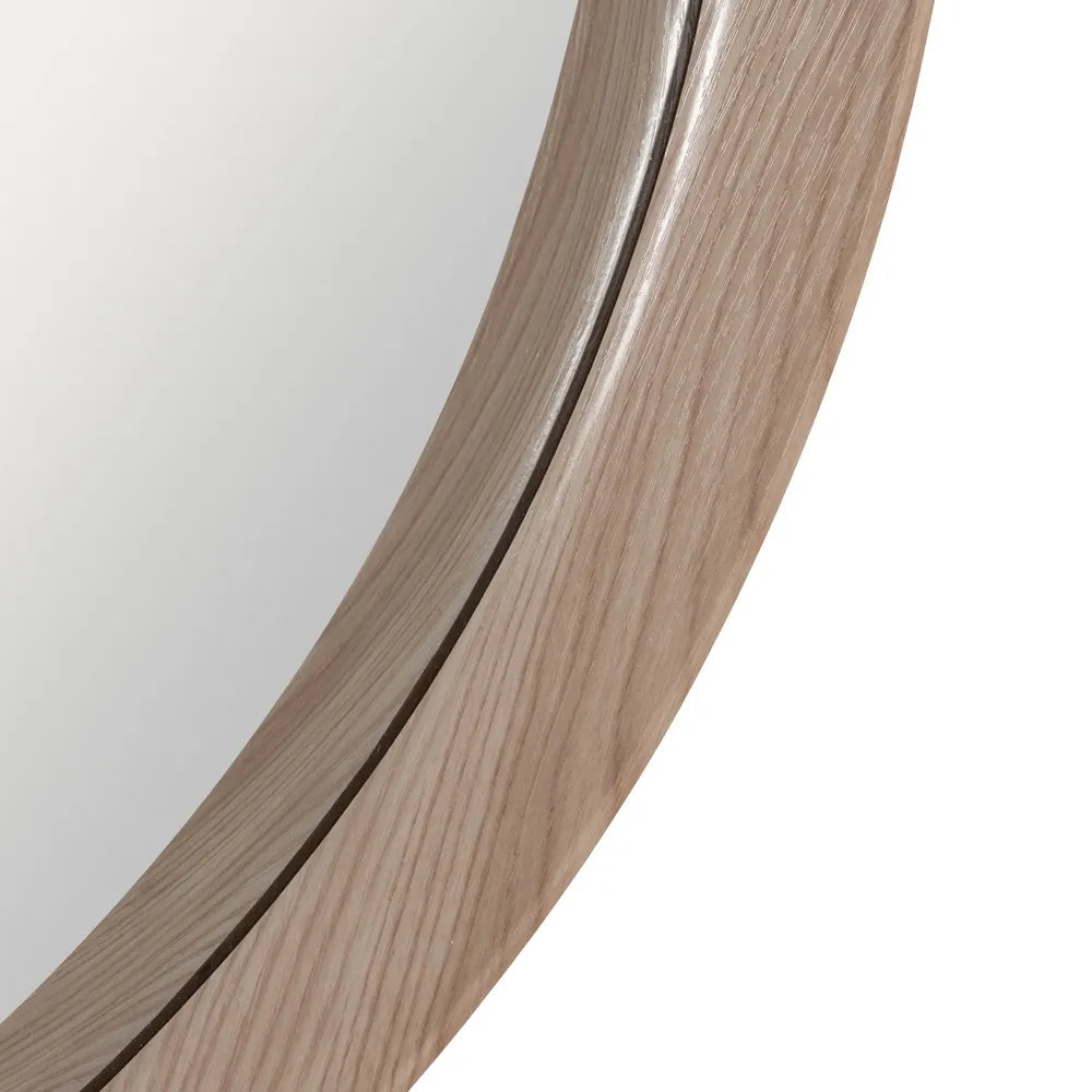 Alba round wall mirror with natural nude MDF frame in a modern interior