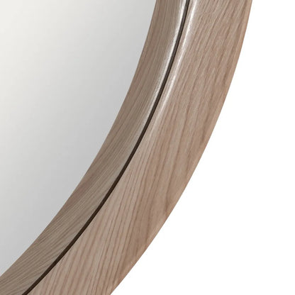 Alba round wall mirror with natural nude MDF frame in a modern interior
