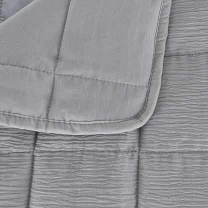 Martina beige and grey polyester quilts neatly folded in a bedroom setting