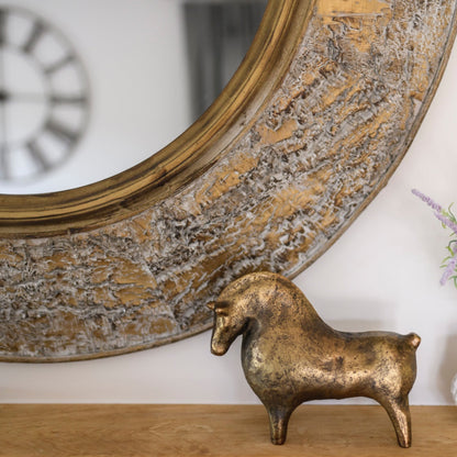 BRAD Round mirror with bark-textured antique gold frame.