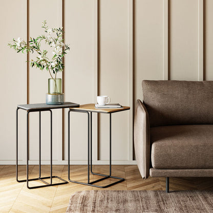 TRAVIS Set of 2 Side Tables with contrasting black and golden tops and sleek black metal frames.